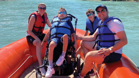 The Bassil family in an inflatable watercraft