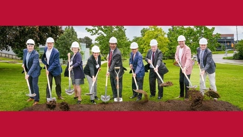 Local leaders and the WEI campaign steering committee break ground using shovels