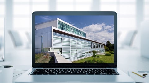 Photo of the School on a laptop screen