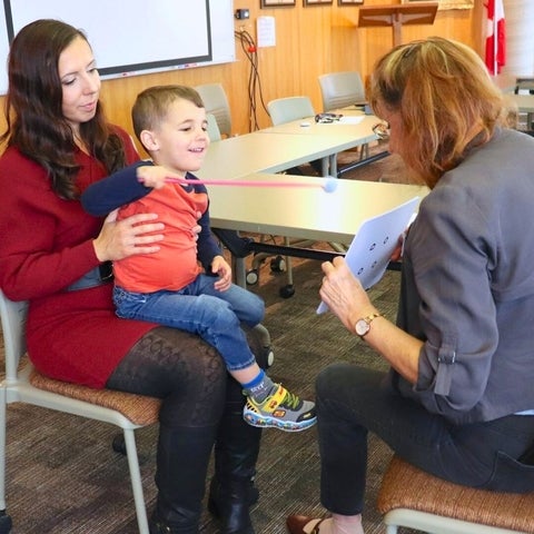 Dr. Susan Leat tests a young patient's vision