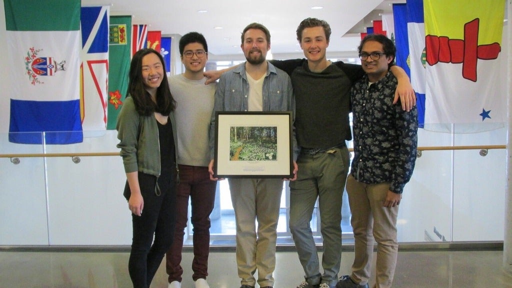 Students pose with one of the art donations