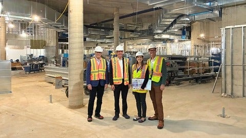 Dr. Ben Thompson and Kelsey Gagnon tour the WEI building space with project leads