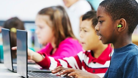 Children in front of computer terminals