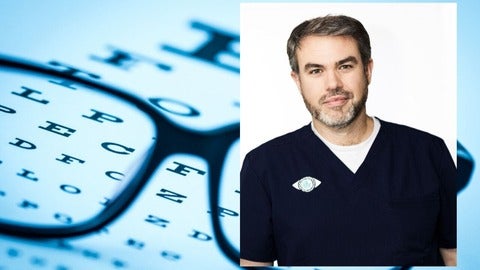 Joshua Smith headshot in front of an eye chart