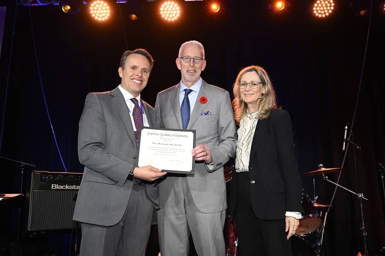 Derek MacDonald receives award at Academy.