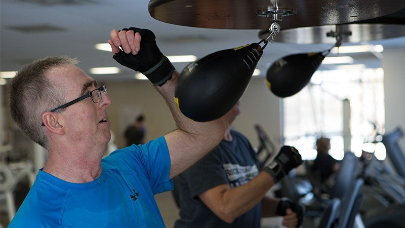 Professor Chris Hudson works out in the boxing fitness class at the YMCA