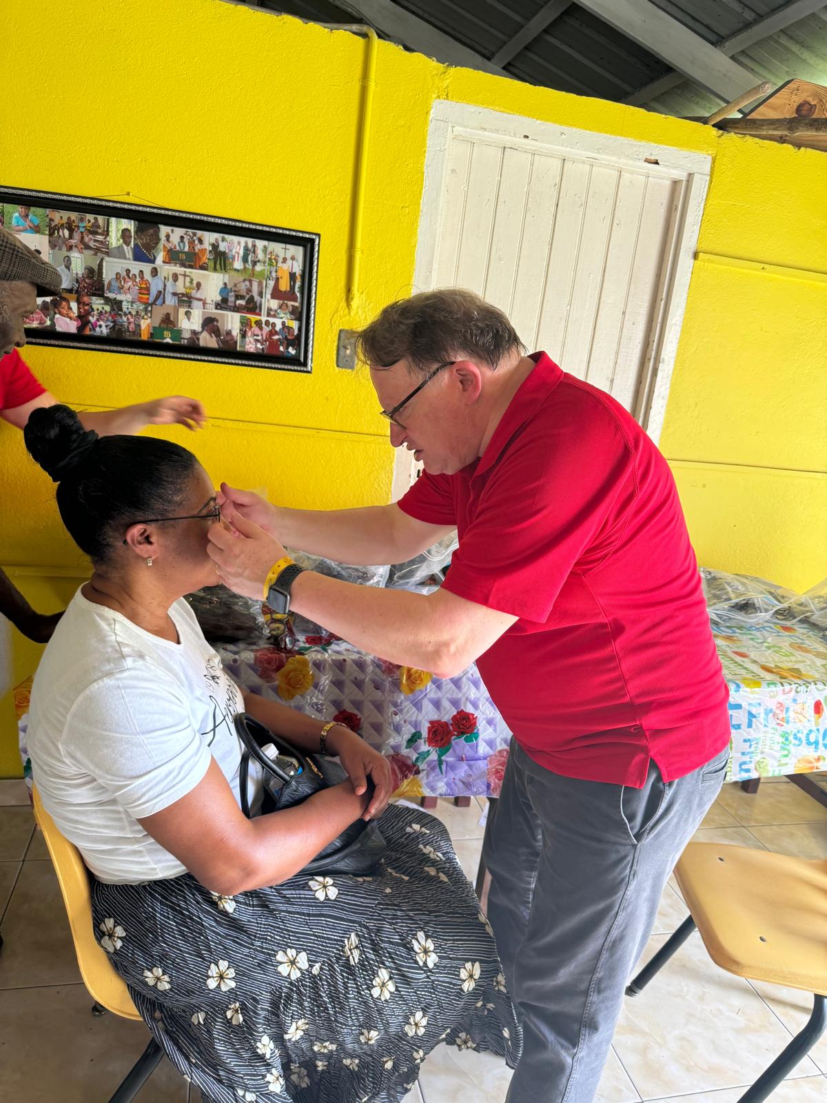 Dr. Gerry Leinweber examining a patient in Jamaica