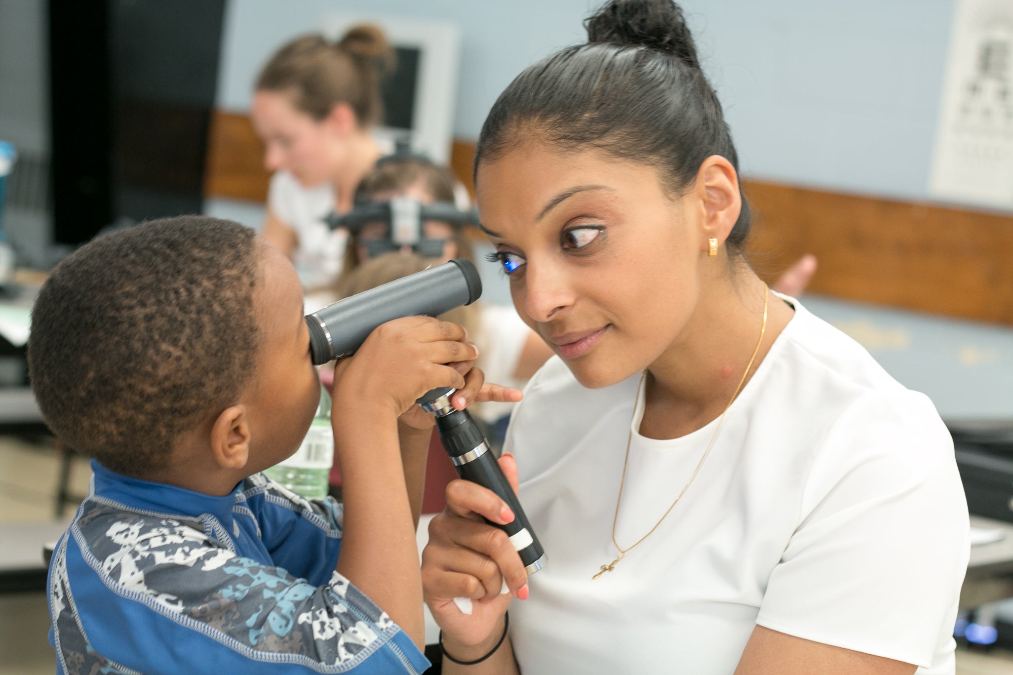 Child tests out eye equipment