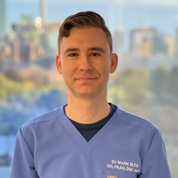 Dr. Mark Eltis headshot wearing scrubs