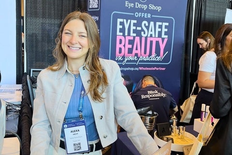 Alexa Hecht representing a brand at a trade show in front of a sign reading "Eye-Safe Beauty"