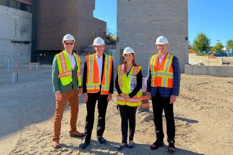 Four people in hard hats
