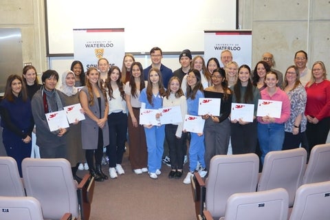 Group of students with awards