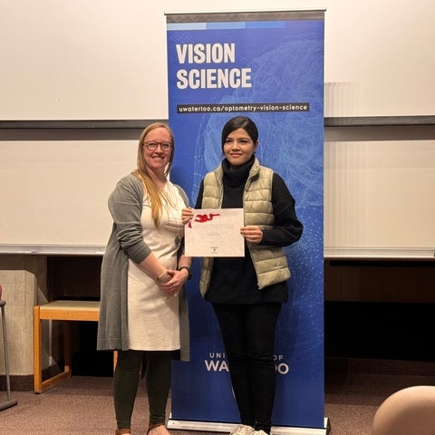 Dr. Kristine Dalton with student holding certificate