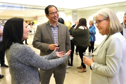 Three people talking