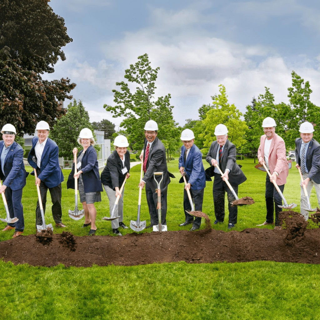 Groundbreaking participants throw dirt