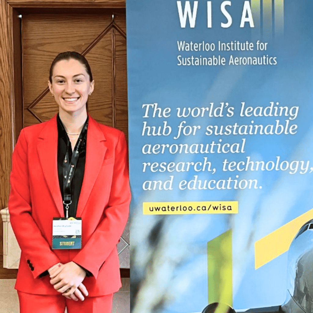 Heather Hudecki standing beside WISA sign 