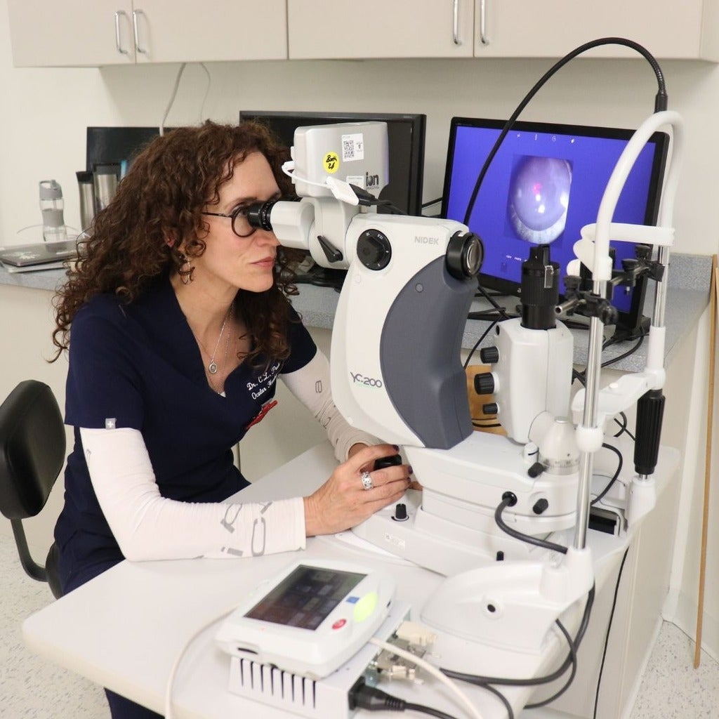 Woman practicing laser procedures