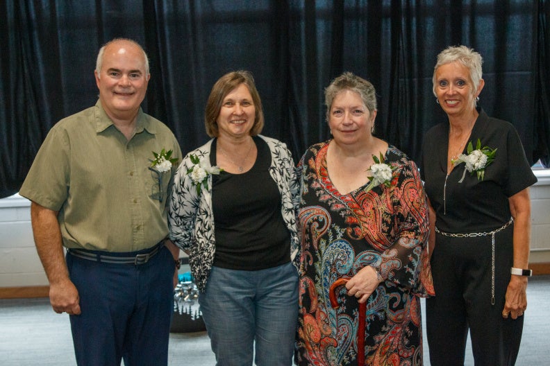 A photo of Marie Amodeo, John Haney, Rosemary Morrison and Marilyn Thom at their retirement reception