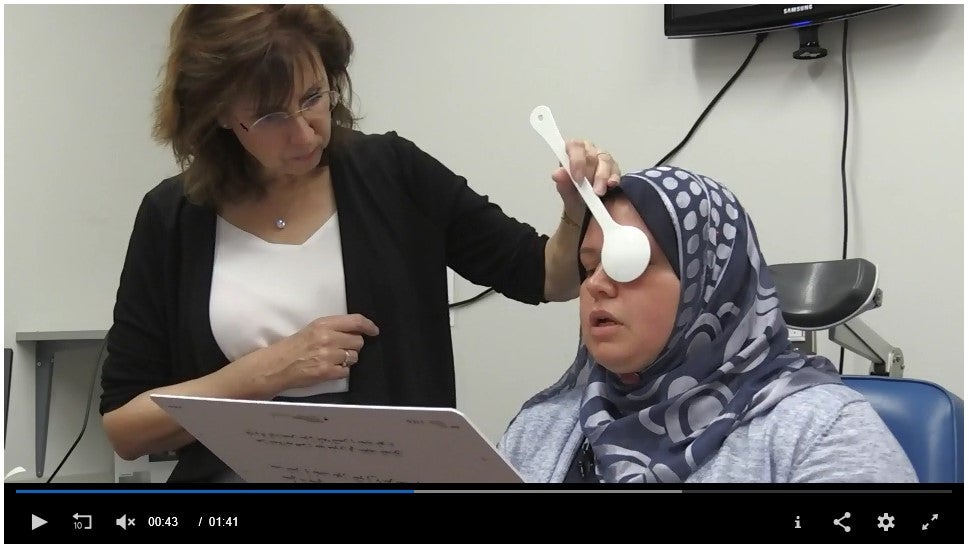Dr. Sue Leat performing an eye exam