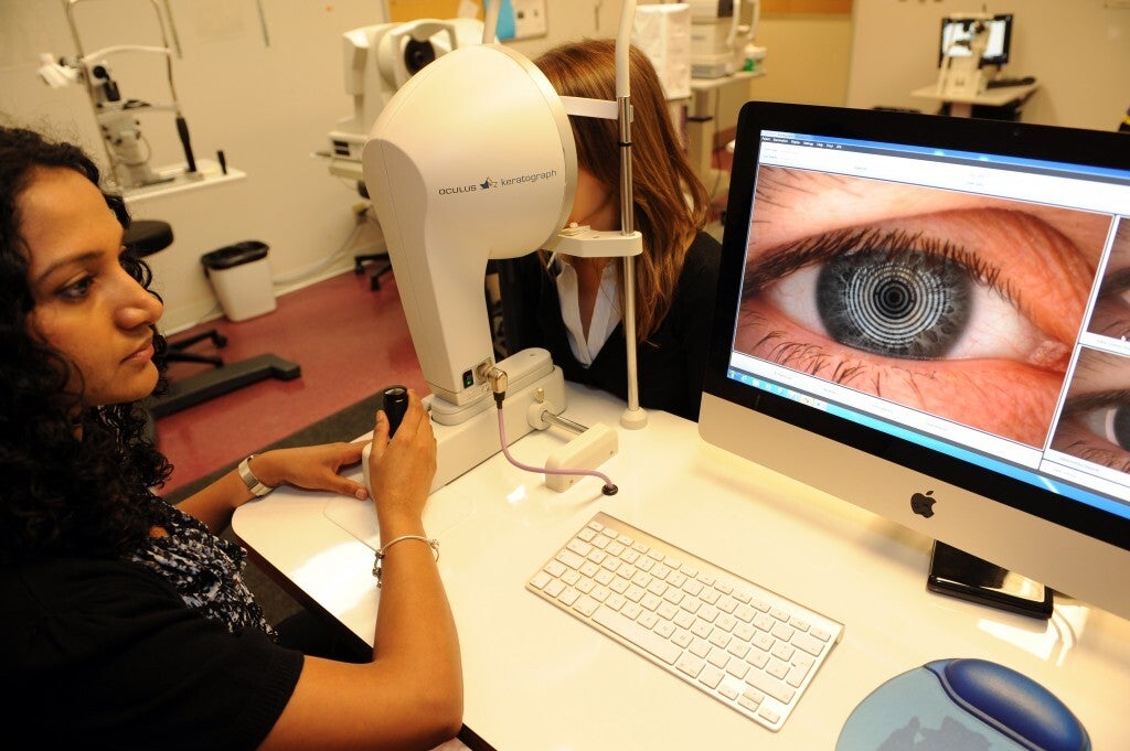 Person conducting Corneal Topography Measurement at CORE