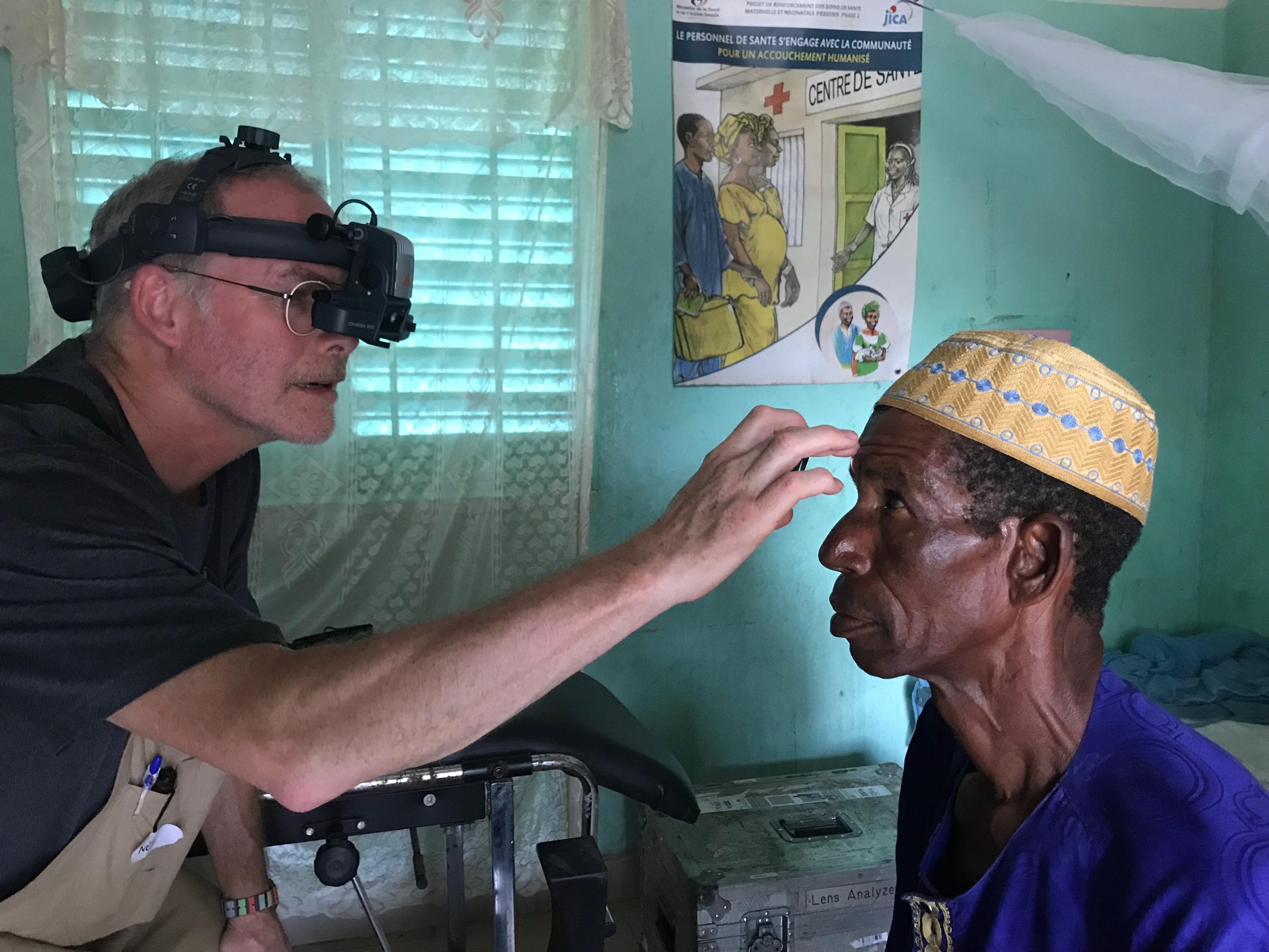 Dr. Neil Paterson completes an eye exam during the clinics