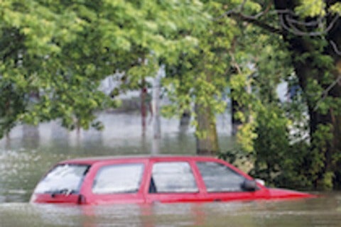 car in flooded waters