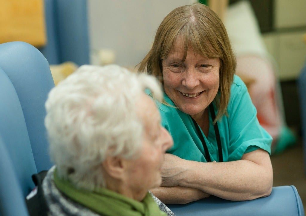 middle aged woman with senior smiling