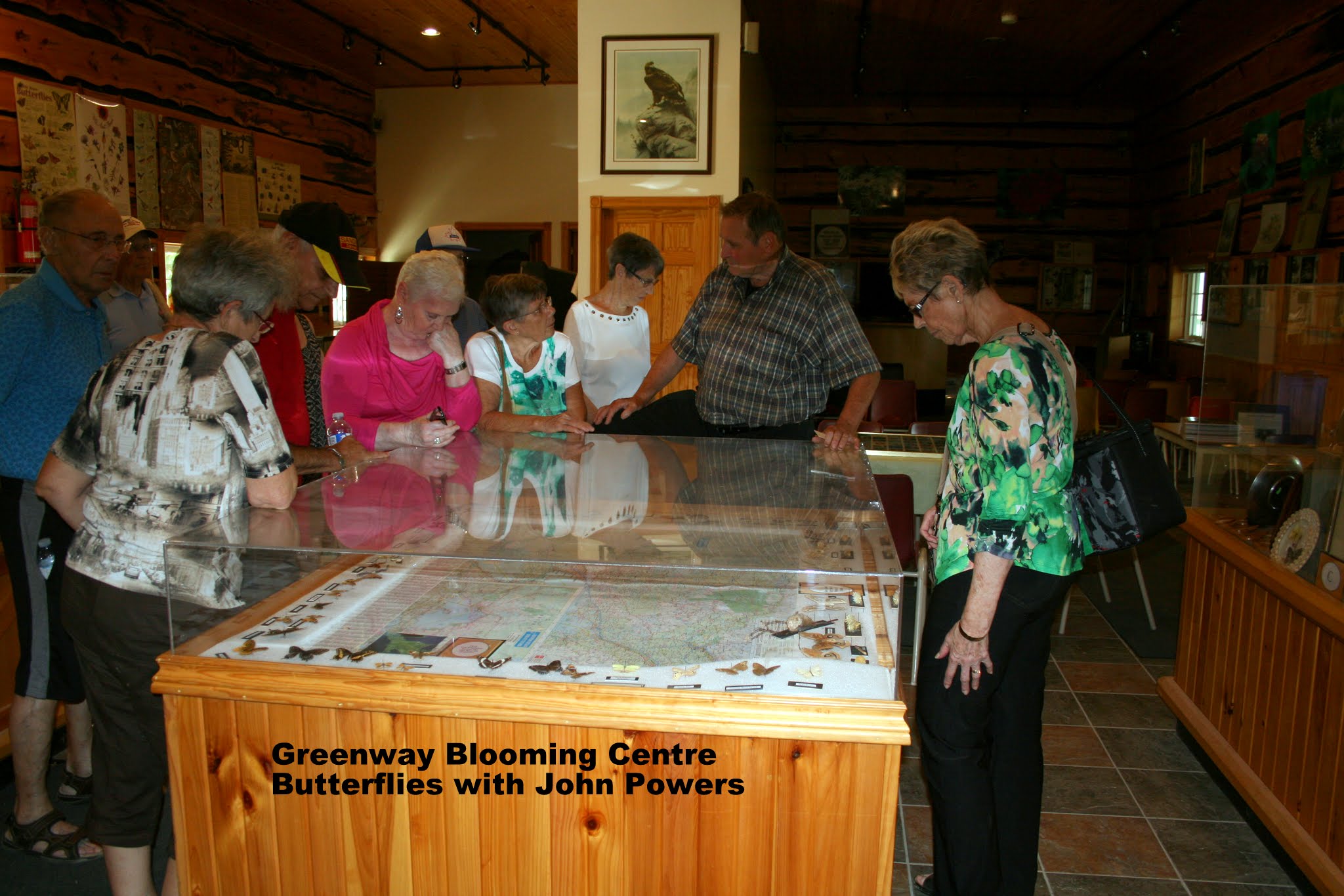 a group of people looking at artifacts