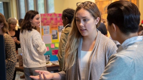 student presenting at an event