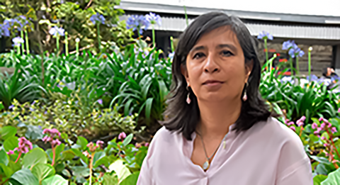 Maria Lucia Zapata Cancelado in a garden