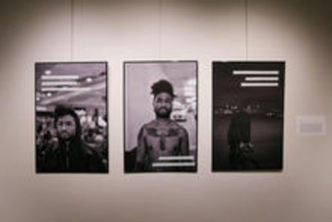 Three framed photographs of a young black man