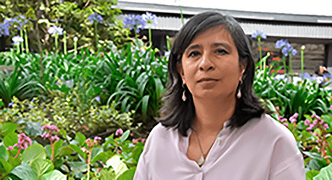 Maria Lucia Zapata Cancelado in a garden