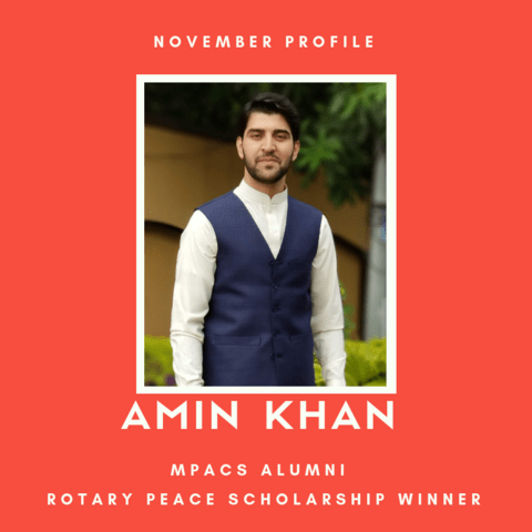 Picture of Amin Khan against a red background. Text reads: "November profile. MPACS alumni. Rotary Peace Scholarship winner."