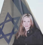 Marianne Popovacki with an Israeli flag behind her.