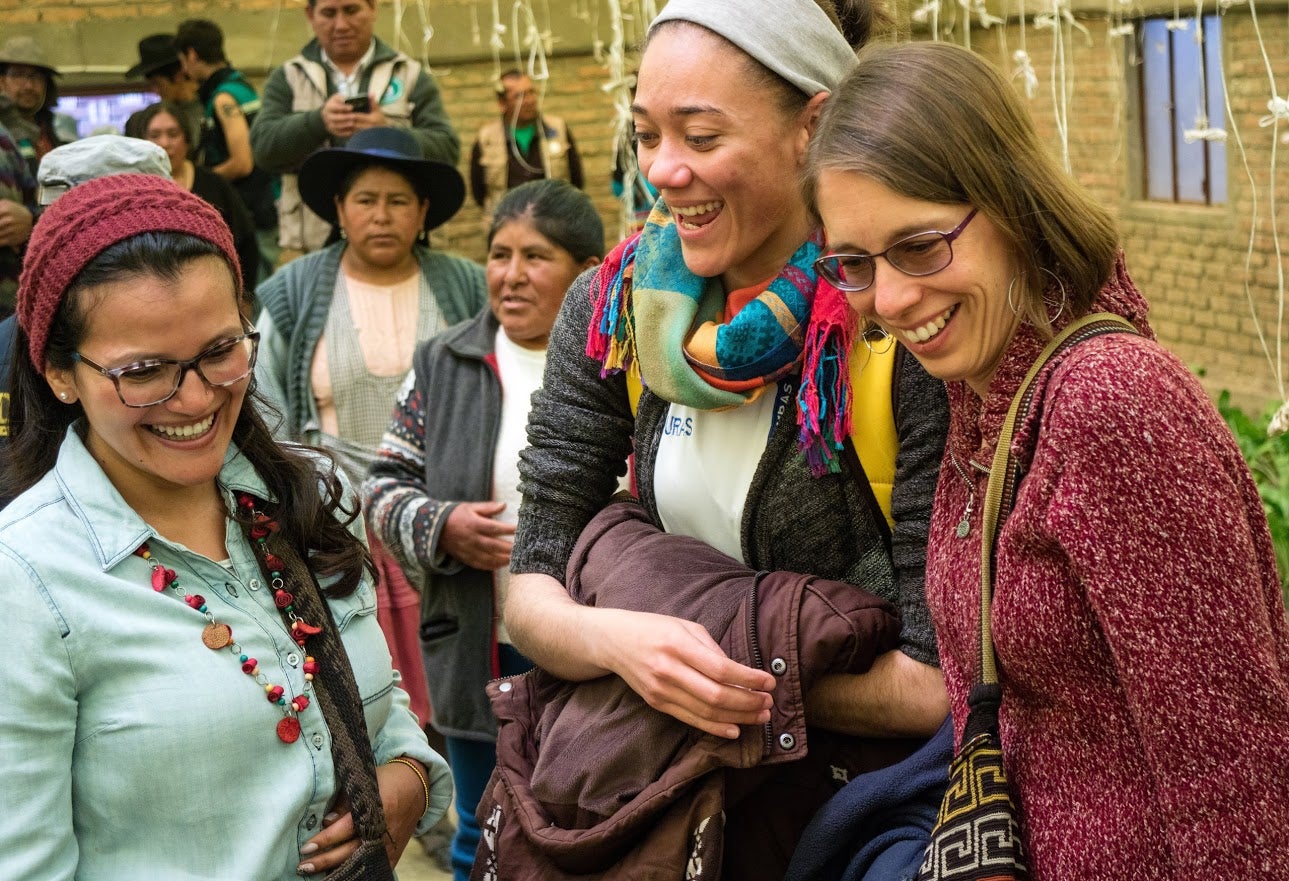 Leidy Muñoz from Colombia on the left and Mei Ling Dueñas from Honduras in the middle, while visiting a community garden project in Bolivia