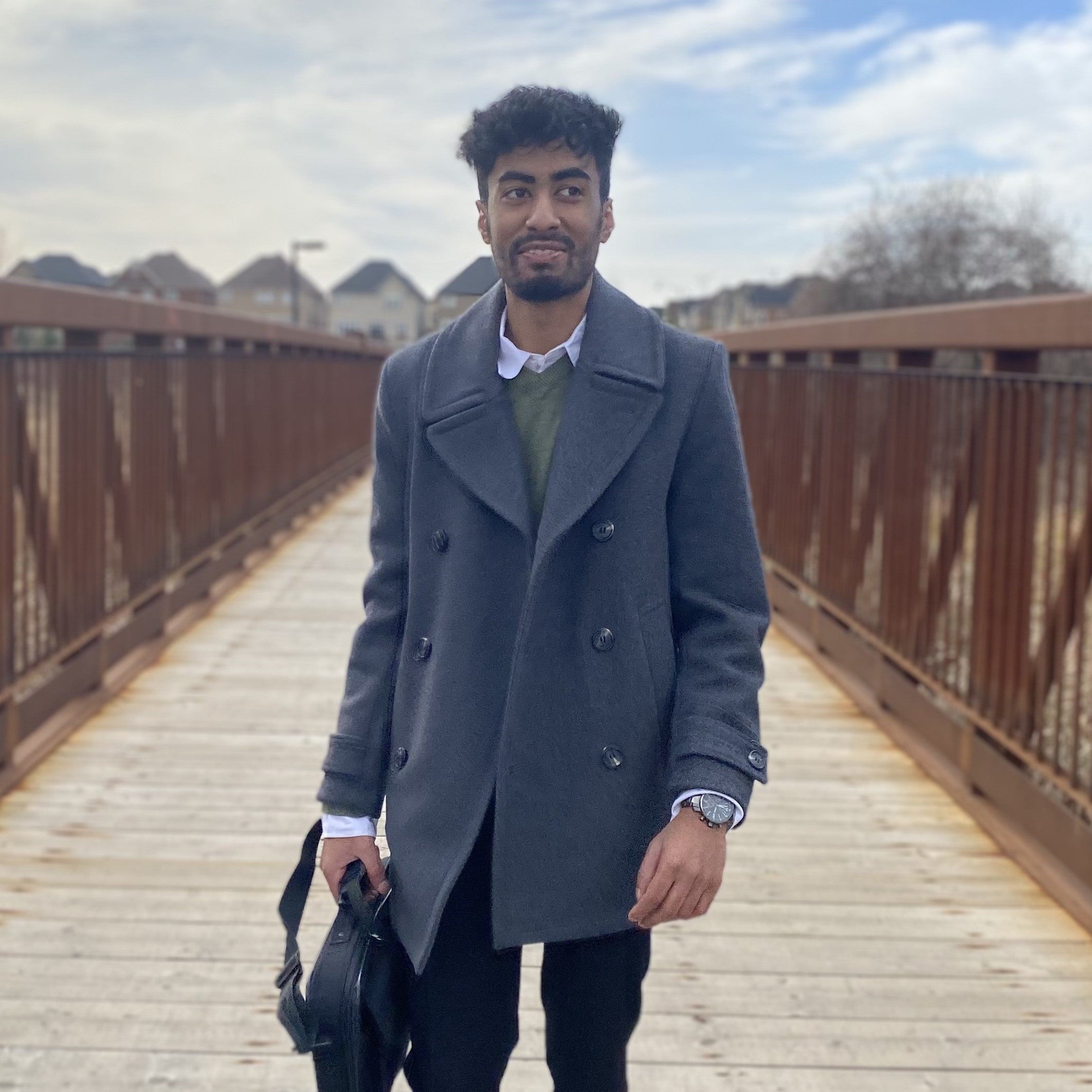 Kissor Nithiananthan standing on a bridge