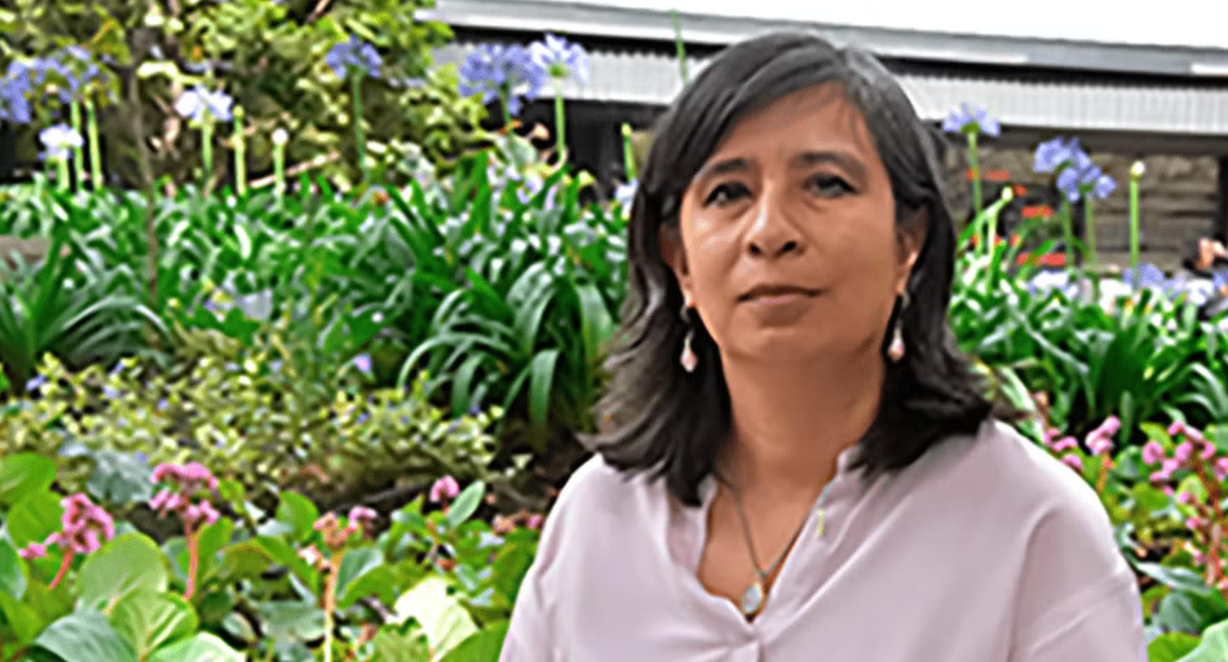 Maria Lucia Zapata Cancelado in a garden