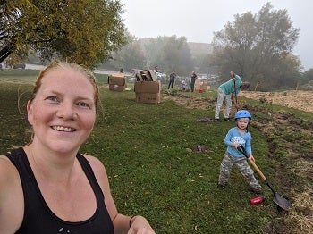 Steph with son helping to create a free public food forest in Wilmot to increase accessibility of healthy food options
