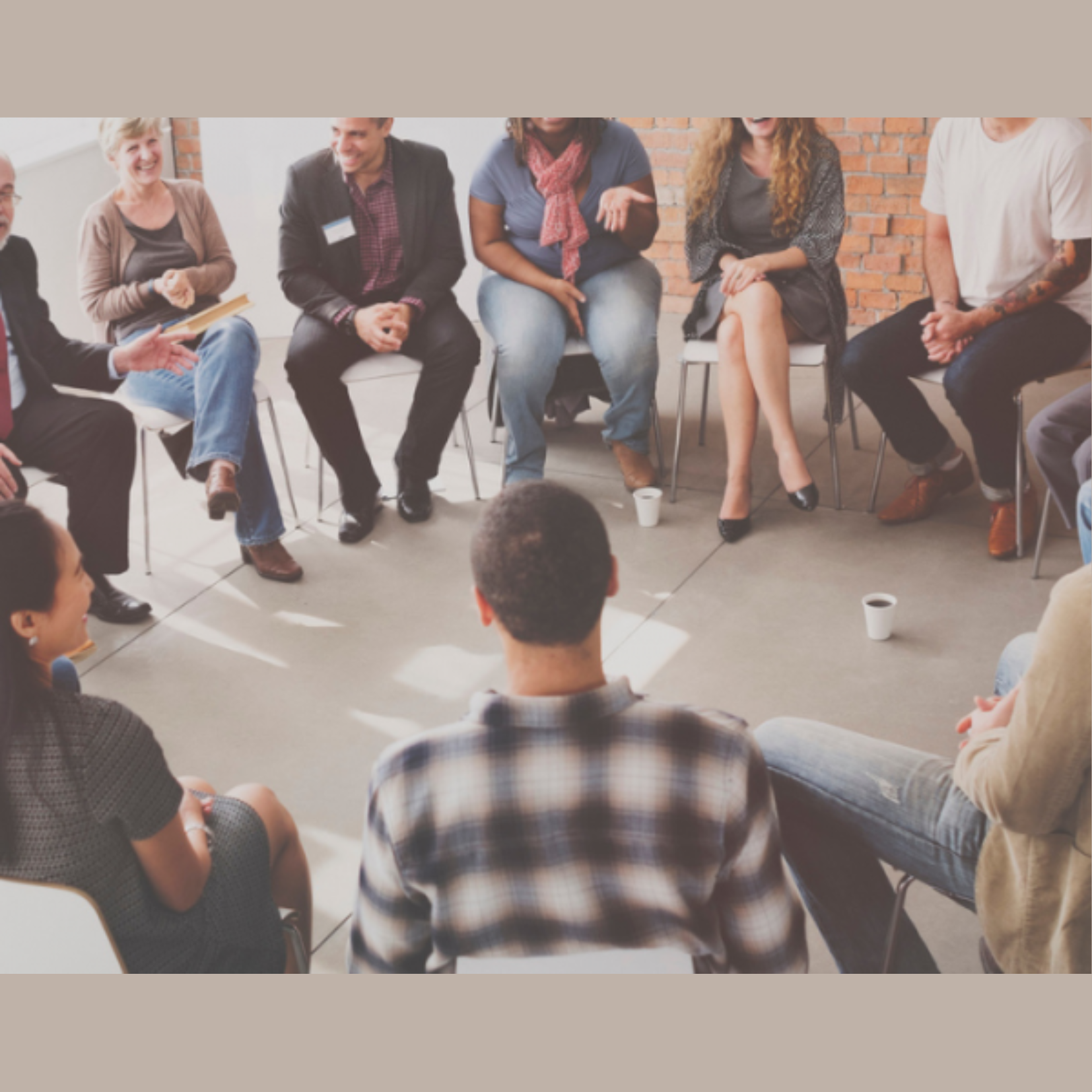 people sitting in a circle and conversing together