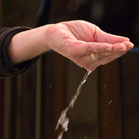 Cupped hand with flowing water