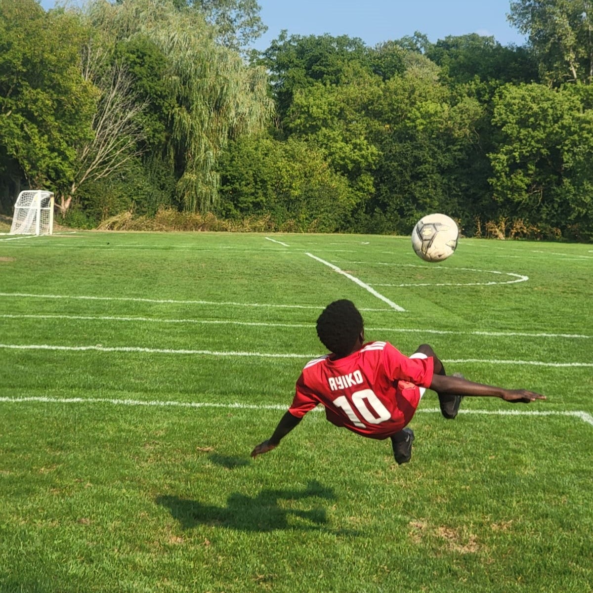 Boy diving for the soccer ball