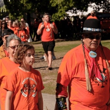 Indigenous elders lead the orange shirt walk around ring road