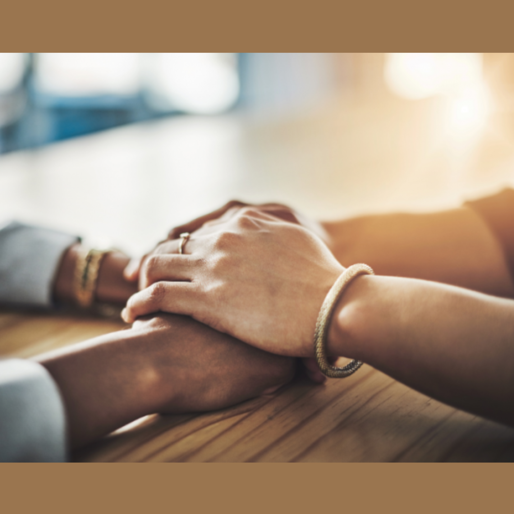 Two sets of hands are supporting each other