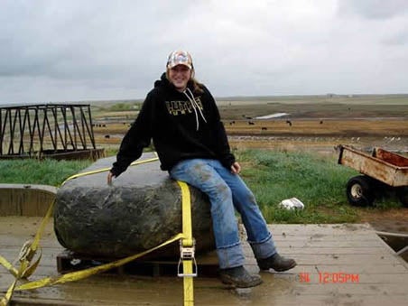 A women sitting on the Kenton's rock.