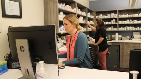 Two people working in a pharmacy