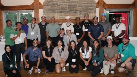 A group of people smiling