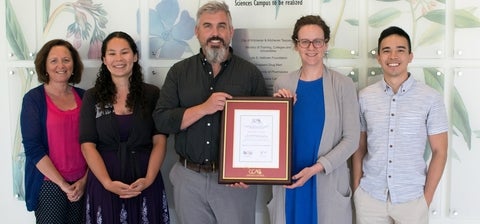 Mary Stanley, Alana Rigby, Mike Beazely, Kelly Grindrod and Adrian Poon with the award plaque