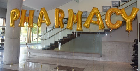 Balloons spelling out pharmacy