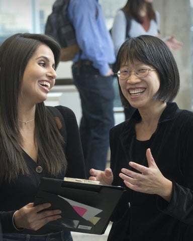 Student and mentor talking and laughing