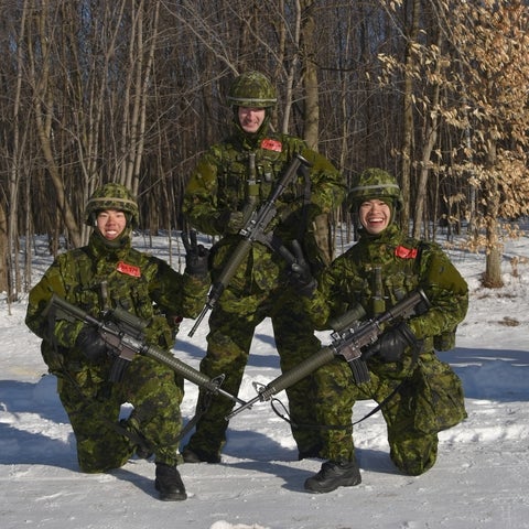 Sean Chih in army gear with two others also dressed in gear